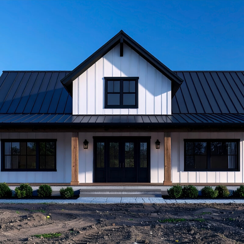 pre-construction was a critical element to our success building this White-farmhouse-style-barndominium-exterior-with-black-trim-and-dark-gray-roof-under-clear-blue-sky-daylight-scaled.jpeg January