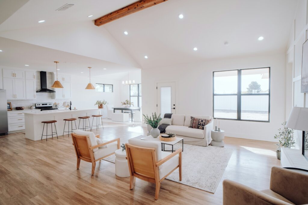 Burn to Minimum Cost may include Flooring and Faux Beams like in this open concept: Barndominium