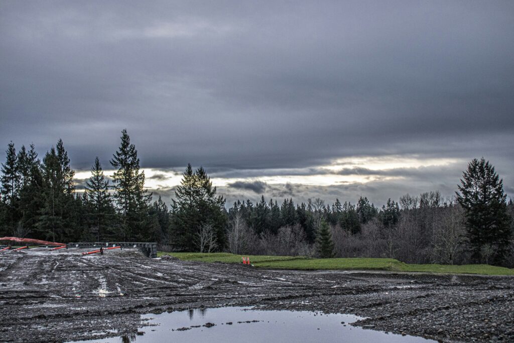 40x60 steel building kits do not include grading or dewatering as evidenced in this job site photo of a muddy steel building site 