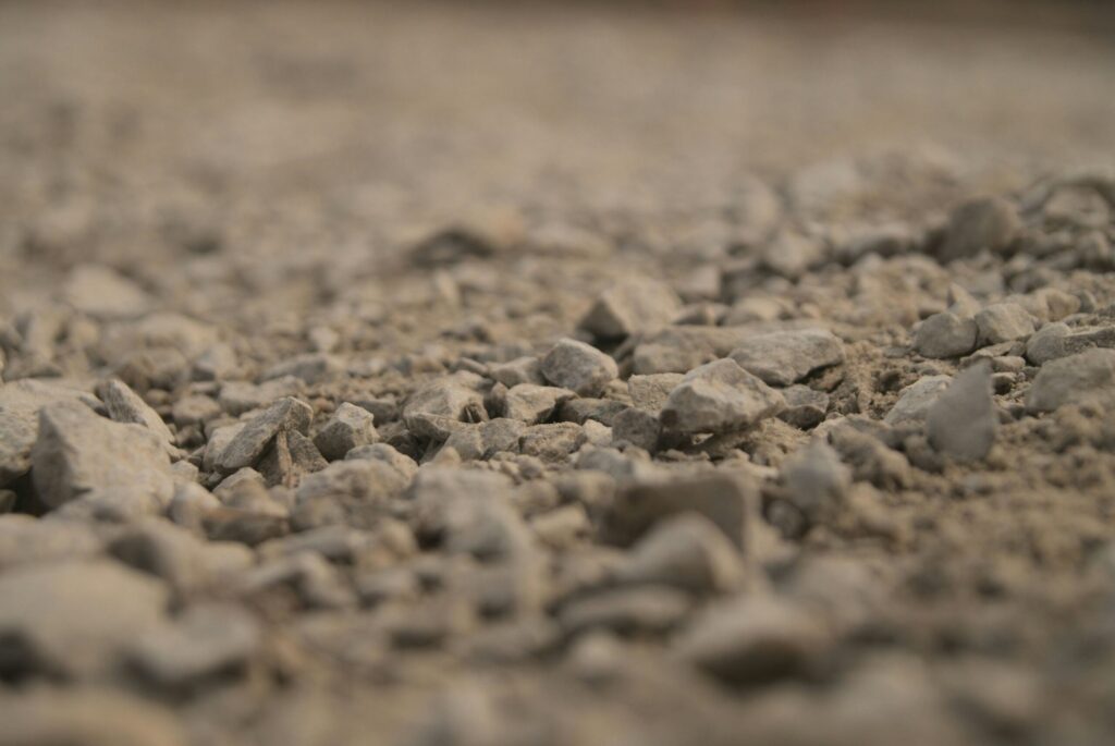Metal building site preparation often includes limestone, road base, or heavy gravel.